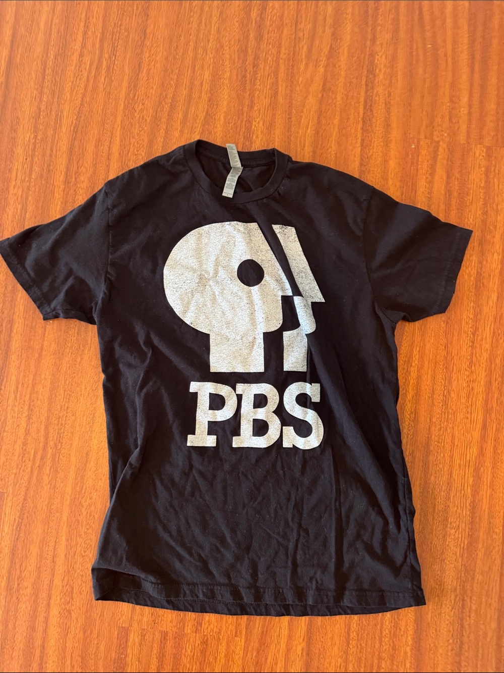 Next Level Apparel Black Tee with Silver PBS Logo